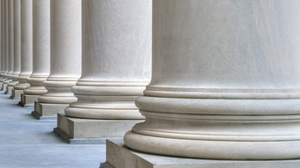 A row of tall, white stone columns.