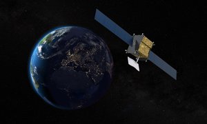 A satellite hovering in the atmosphere above the Earth