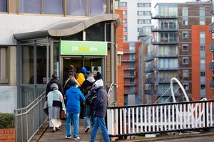People waiting in line in front of a job centre