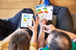 Photograph of two people checking energy labels on their phone