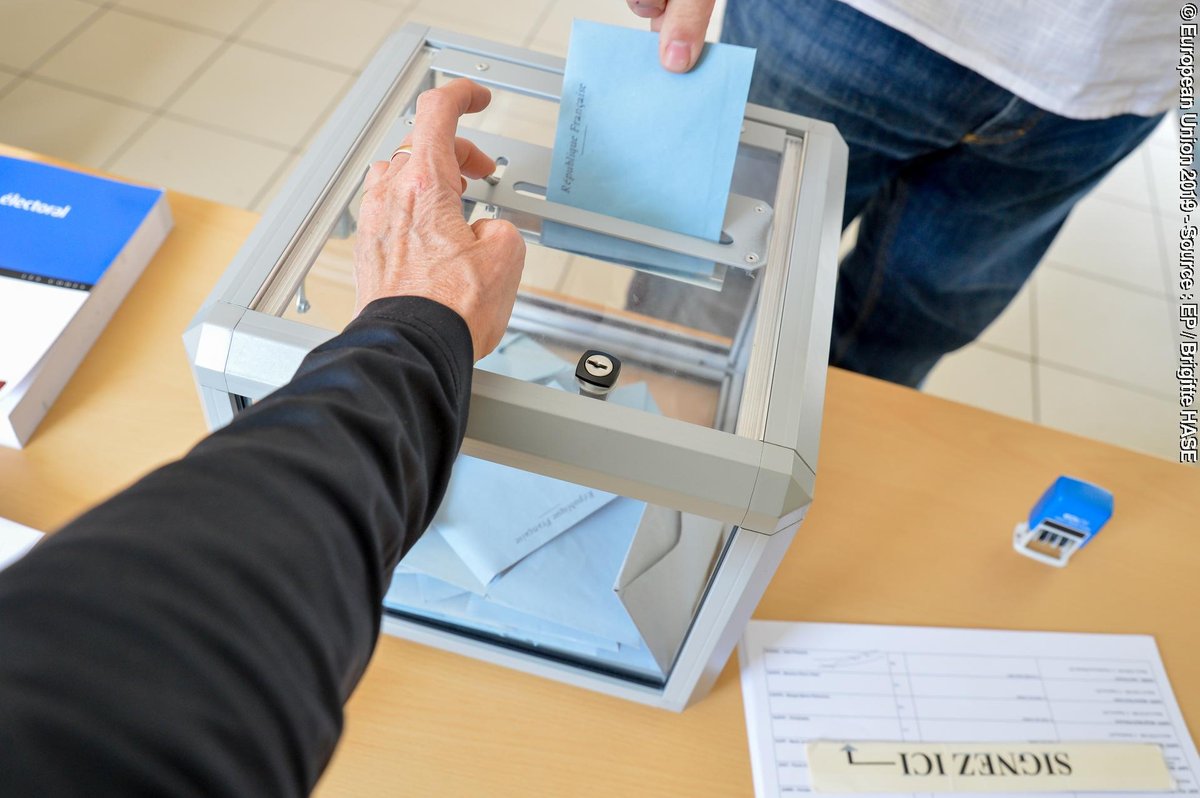 casting a vote at the ballot box