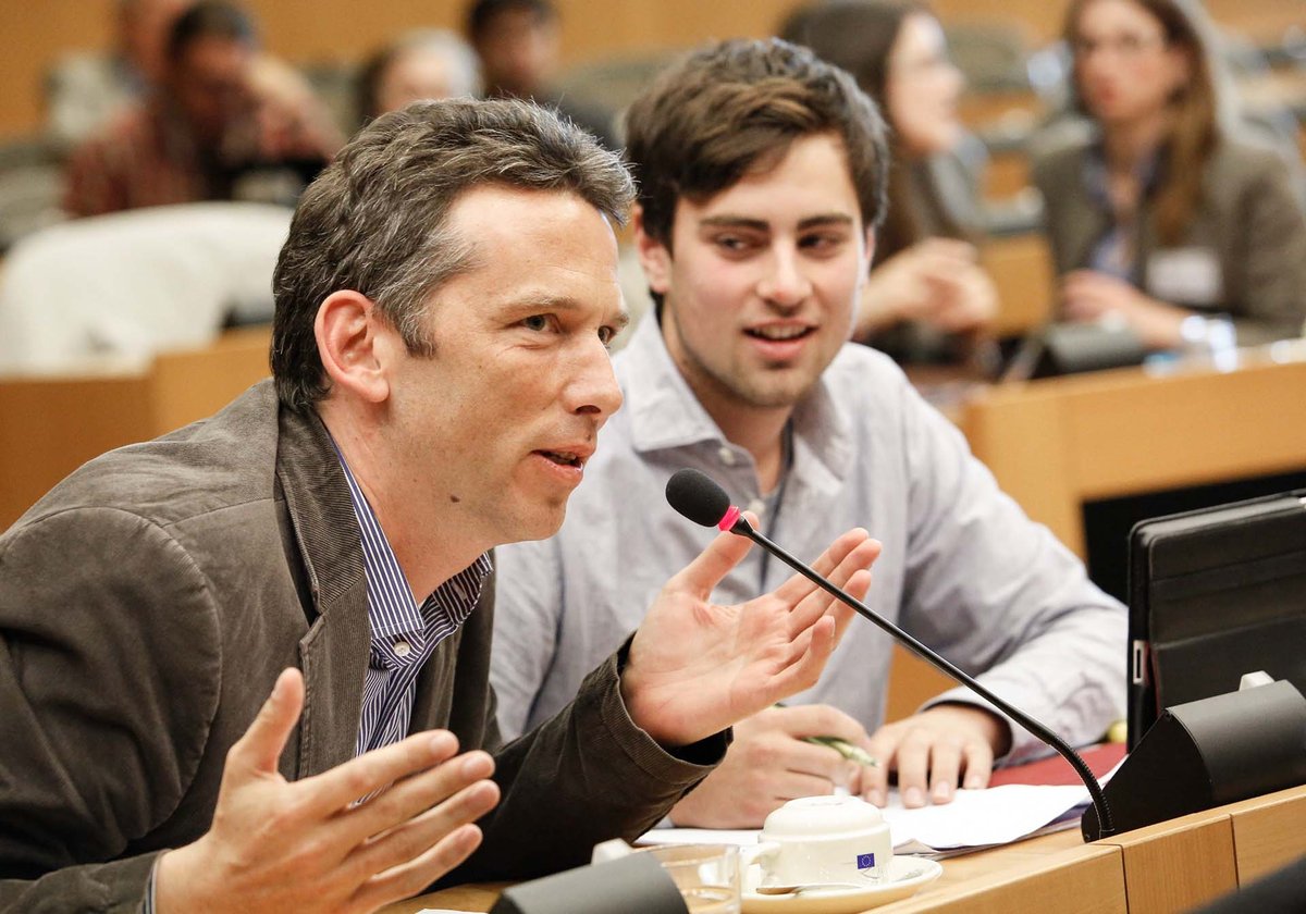 Photograph of a group of people, one speaking into a microphone, at a 'Citizens first!' discussion in the European Parliament.