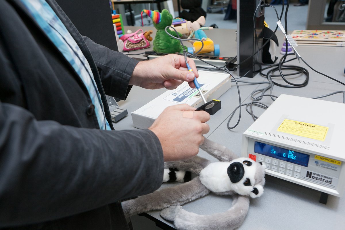 Photograph of a person testing suspicious toys.