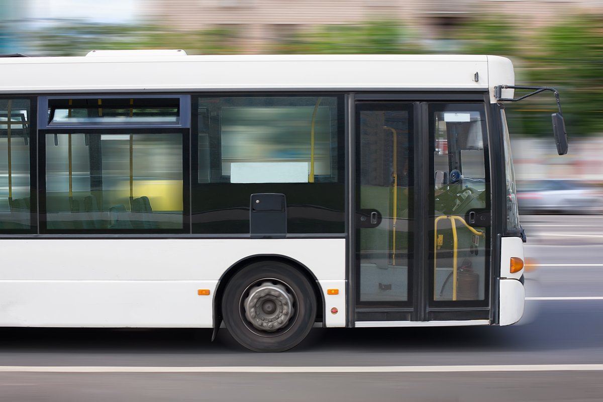 Photograph of a city bus in motion.
