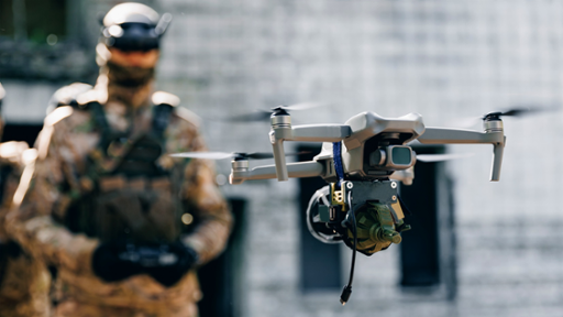 Soldier UAV operator launches army drone with bomb to drop into enemy fortifications and trenches